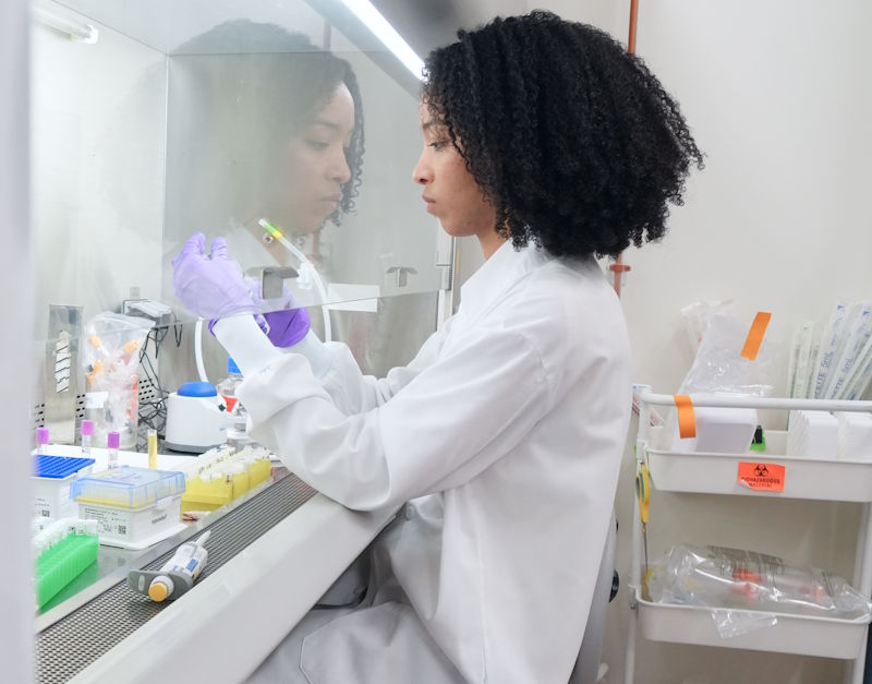 An ALS TDI scientists performing experiments in the lab.